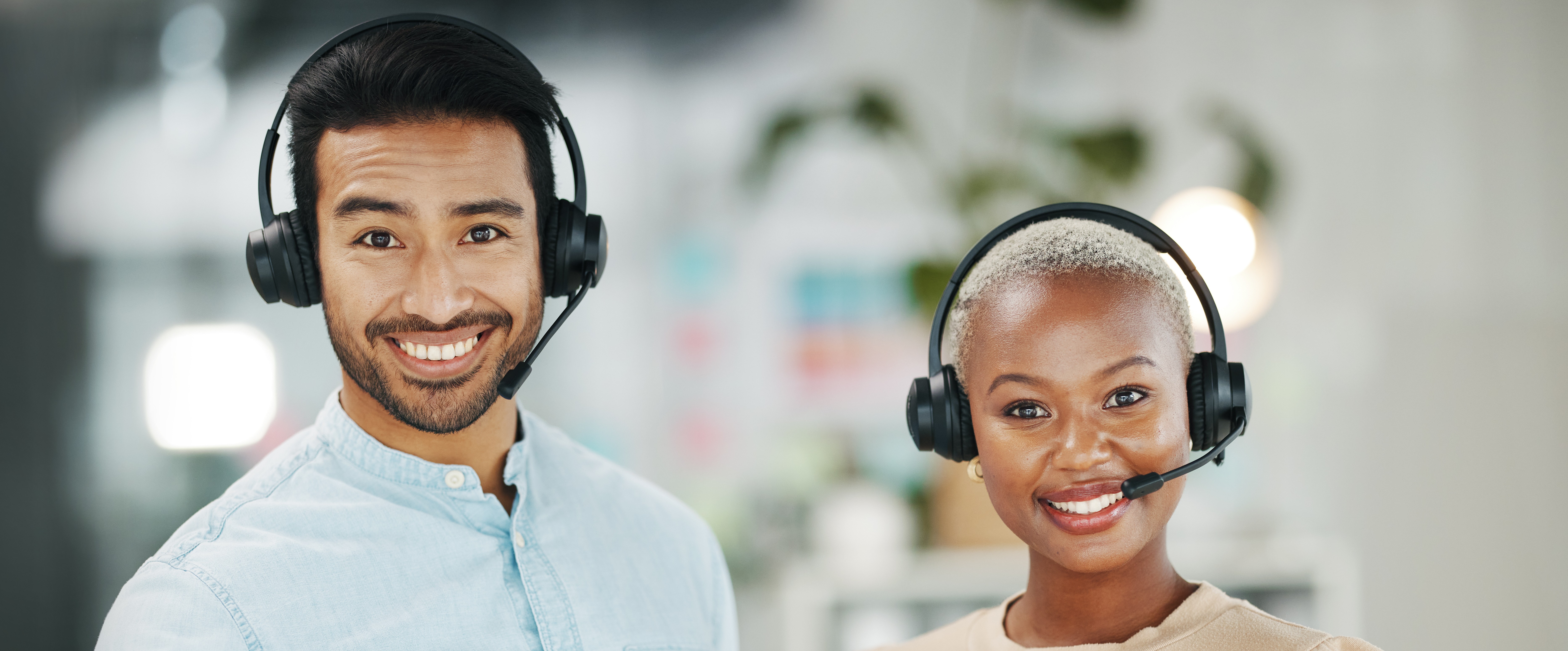 Support team smiling with headsets